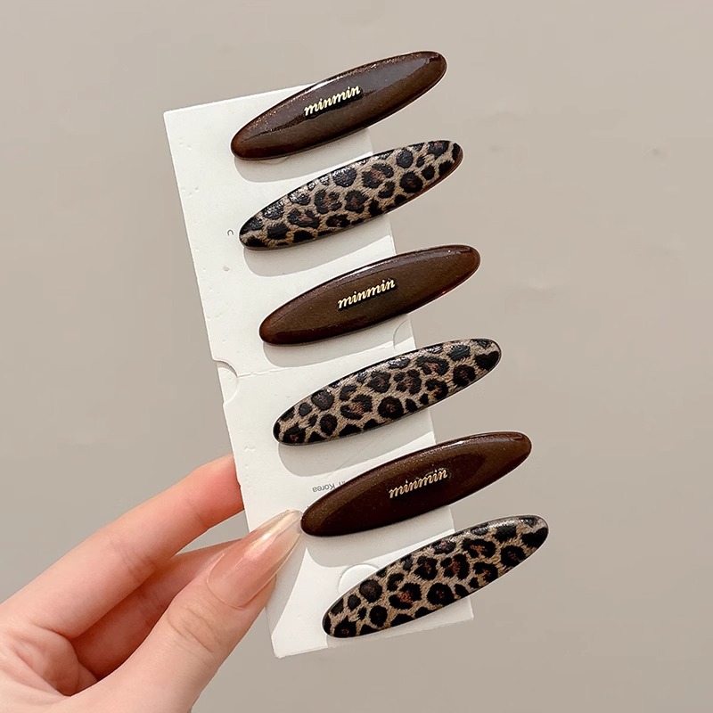 Temperamento acético cabello estriado lateral clip de cabello 2025 nuevo estilo retro puerto clip de boca de pato simple clip de cabello tocado