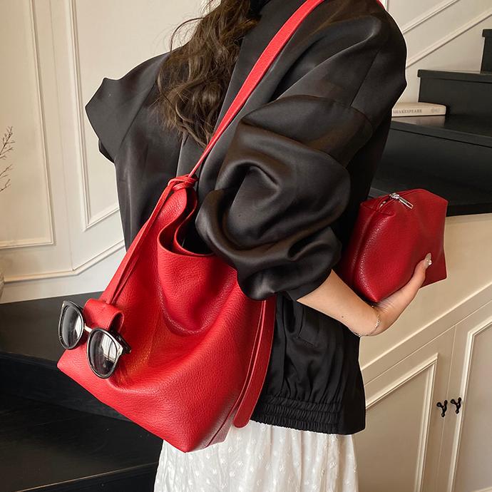 Bolso de cubo de mano de moda de comercio exterior para mujer 2025 nuevo bolso de hombro simple de venta caliente versión coreana bolso casual de alta gama