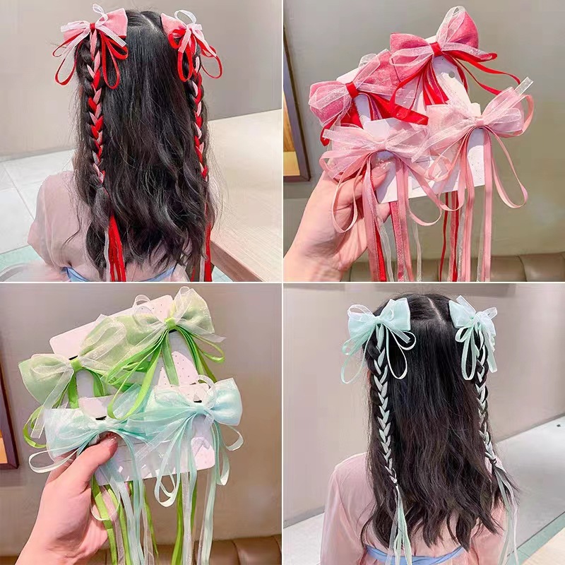 Children's hairgrip with bow with tassels