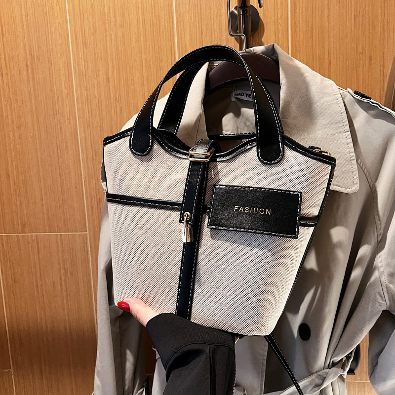 Bolso de lona para mujer 2026, nuevo diseño de nicho, bolso de mano tipo cubo, bolso retro de moda, bolso de hombro cruzado tipo cesta