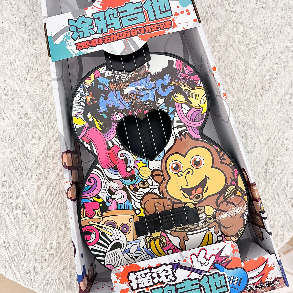 Niños graffiti ukulele DIY simulación tocable guitarra pequeña instrumento musical puzzle juguetes de educación temprana regalos de la institución