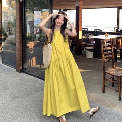 フレンチイエロー気質ラウンドネックベストドレス女性のための 2025 夏の新しいホルターネックルーズ痩身ロングスカート