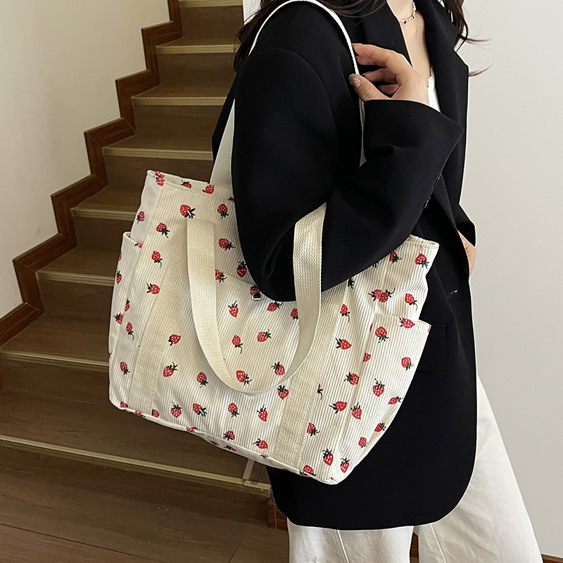 Coreano ins chica impresión de fresas viaje mochila 2025 nueva gran capacidad velcro bolsa de mano casual
