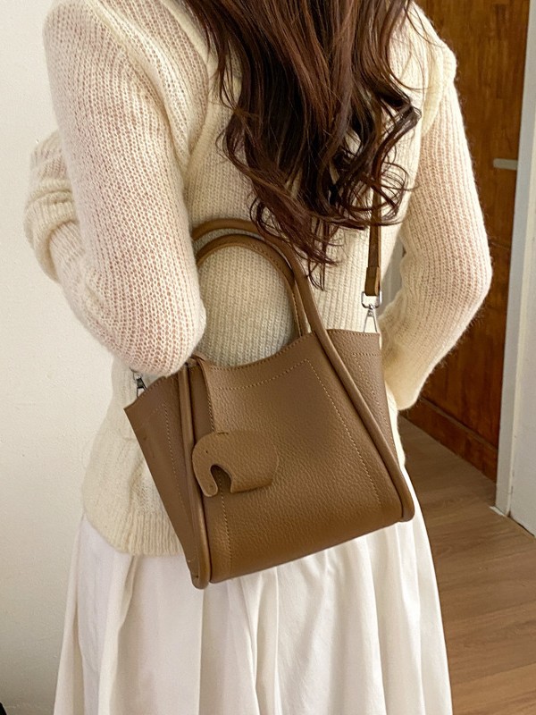Bolso para mujeres 2026 nuevo estilo de moda bolso de cubo portátil de alta calidad lichi patrón popular lujo ligero mochila casual