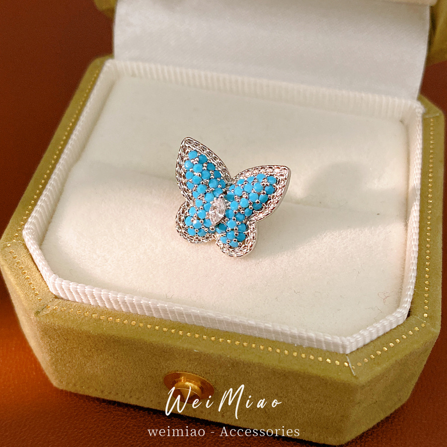 Piedra azul mariposa auriculares mujeres sin agujeros de orejas personalidad nicho pendientes de moda ligero lujo alta sensación auriculares al por mayor