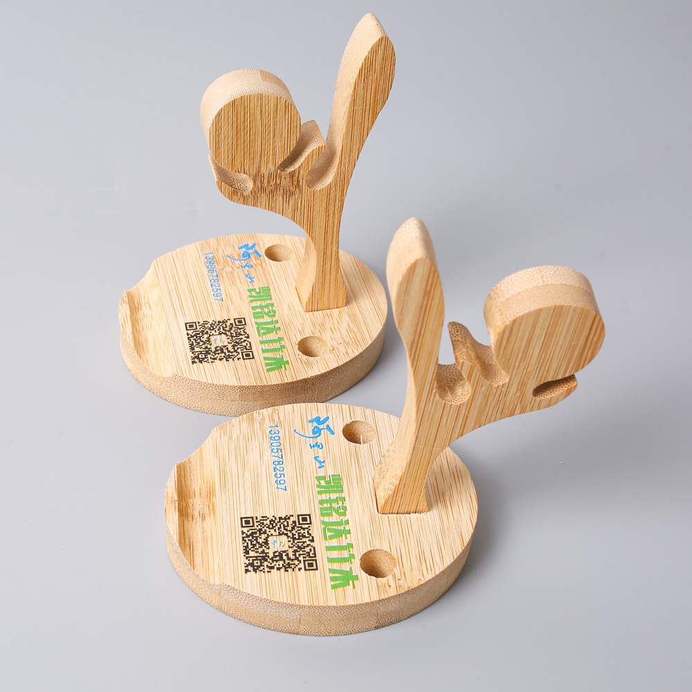 Nuevo soporte de teléfono móvil de bambú multi-funcional creativo escritorio teléfono móvil base perezoso Elk Horn modelado publicidad regalo