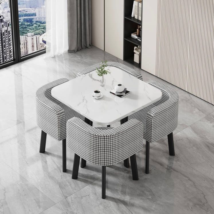 White square table + four houndstooth cloth chairs