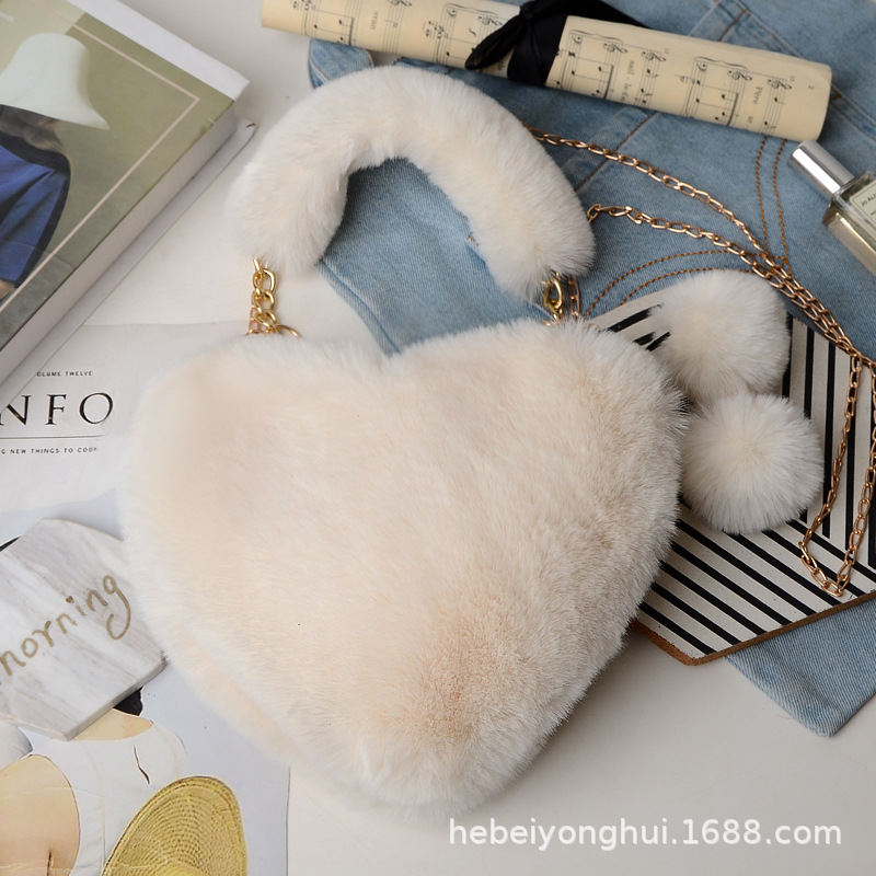 Fabricante en stock bolsa de corazón de melocotón portátil moda felpa en forma de corazón bolsa de peluche bolso de las mujeres