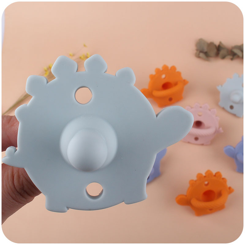 Nuevo bebé de dibujos animados dinosaurio de silicona chupete dientes de bebé juguetes de molienda Amazon AliExpress