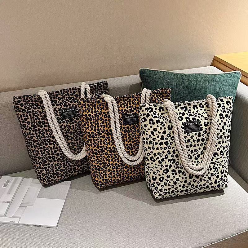 Bolso de mujer 2026 nueva impresión bolso de lona de moda leopardo coreano bolso de gran capacidad bolso de hombro de mano de compras