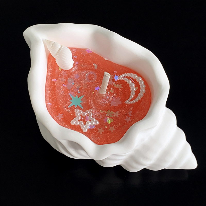 Doftljus formad som snäcka i presentförpackning för stämning_voghion.com