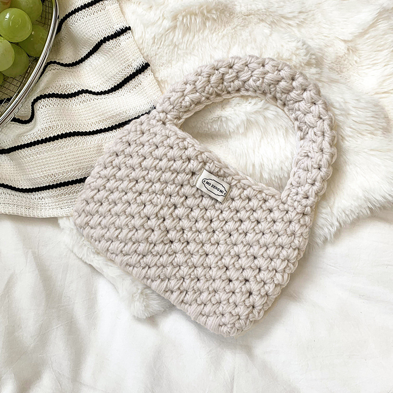 Bolsa de mano de damas de otoño y invierno 2025 nuevo estilo simple ganchillo a mano lana tejido bolsas de hombro al por mayor