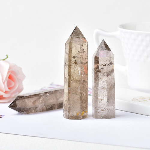 Cross-border hot-selling natural tea crystal column single-pointed hexagonal prism raw stone polished smoky crystal column home office Feng Shui ornaments