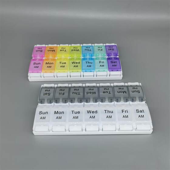 The new button-type double-row 14-cell weekly medicine box silicone bomb cover is easy to press and clear in the morning and evening.