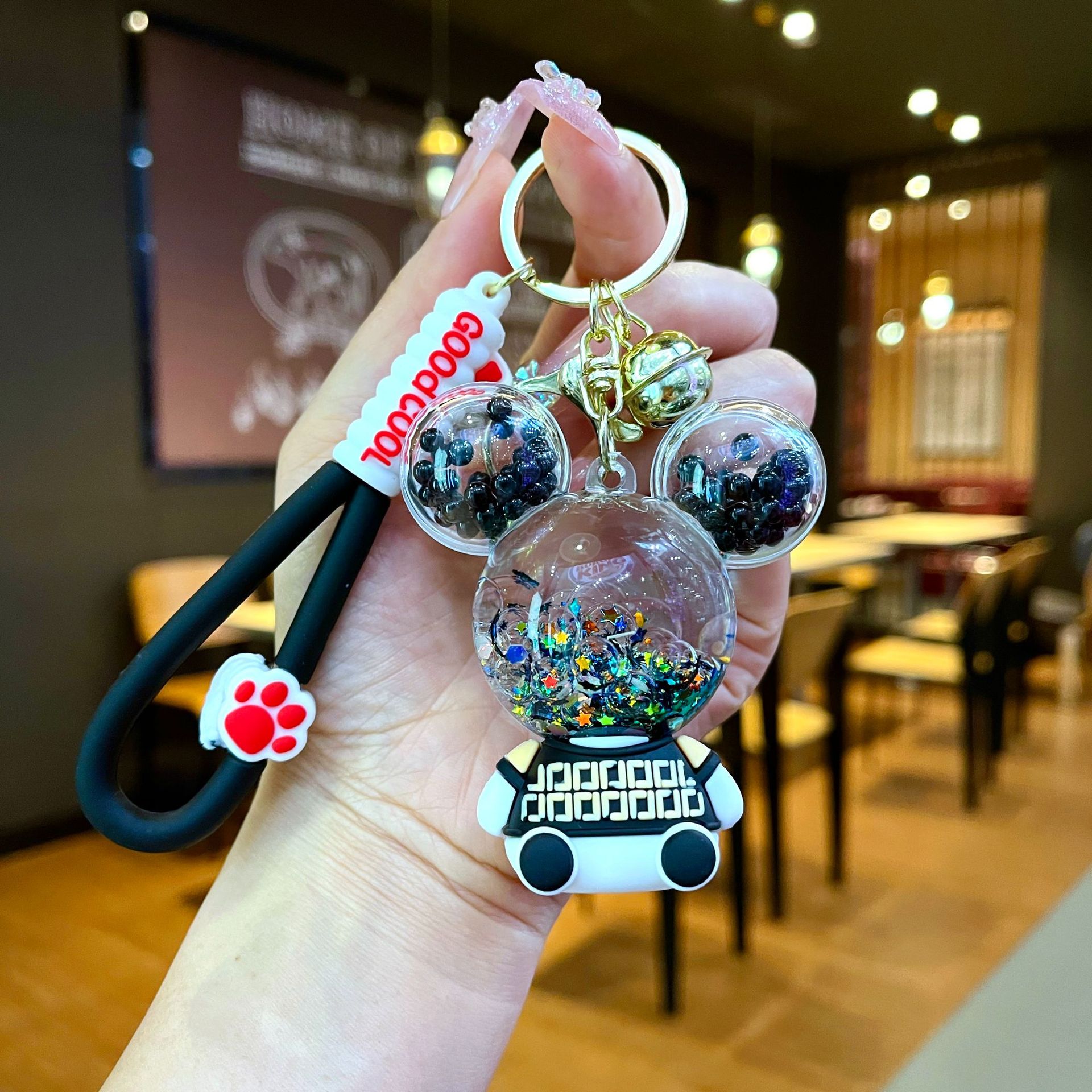 Aceite de gato garra arenas movedizas llavero lindo dibujos animados cadena colgante captura muñeca máquina agarrar pequeño regalo al por mayor