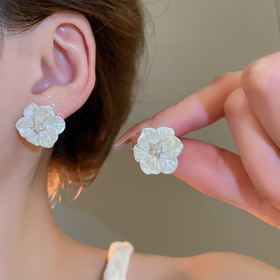 Pendientes de flor de lazo elegante de súper hada de plata Pendientes de moda de lujo ligero francés Pendientes de todo fósforo dulce de estilo literario