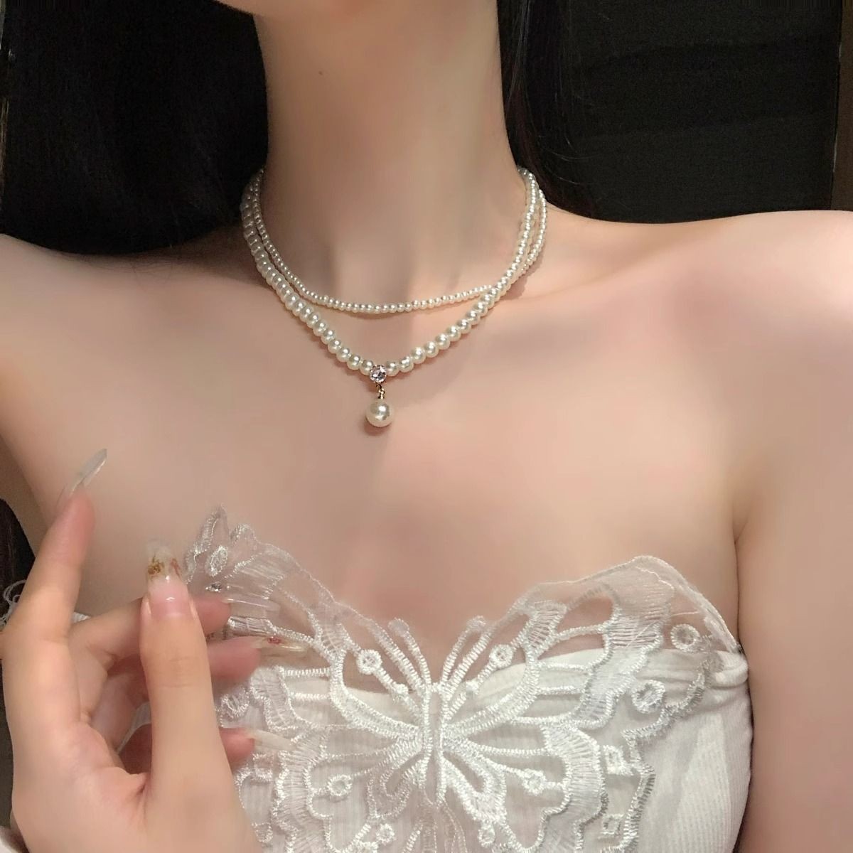 Stacked pearl necklaces