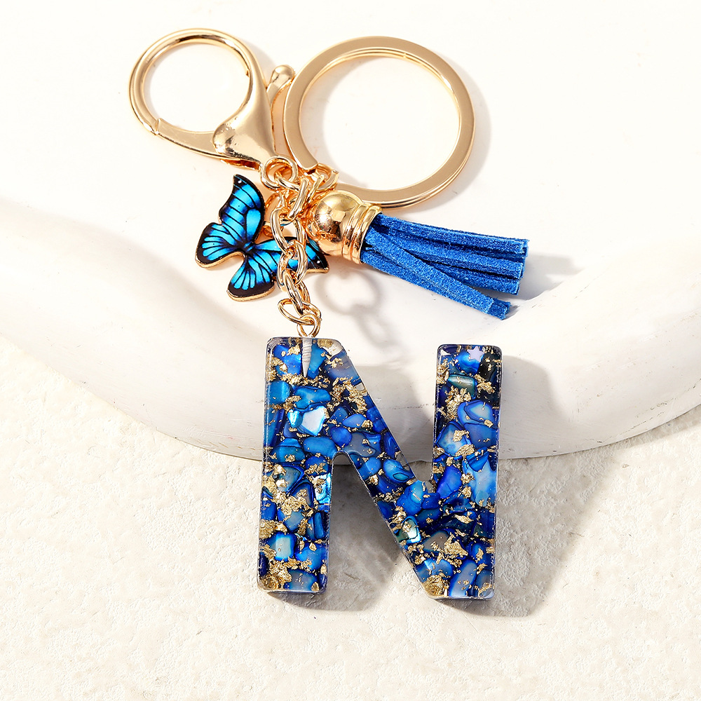 Nuevo transfronterizo mariposa 26 letras inglesas de cristal goteo llavero bolsos accesorios colgante de automóviles