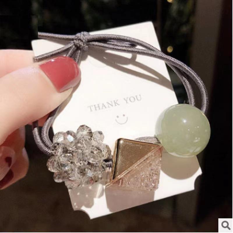 Elástico joyas de cabello de moda con frijoles frescos M anillo de cereza cuerda de cabello al por mayor de la banda de goma cabeza de 100 bolas de cabello rojo una variedad de alta elástica