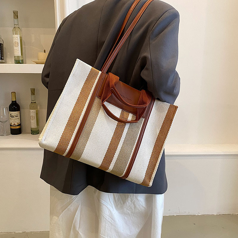Bolso de mujer nueva línea transfronteriza lienzo color contraste bolso de mano rayas nicho de moda alta moda bolso de hombro