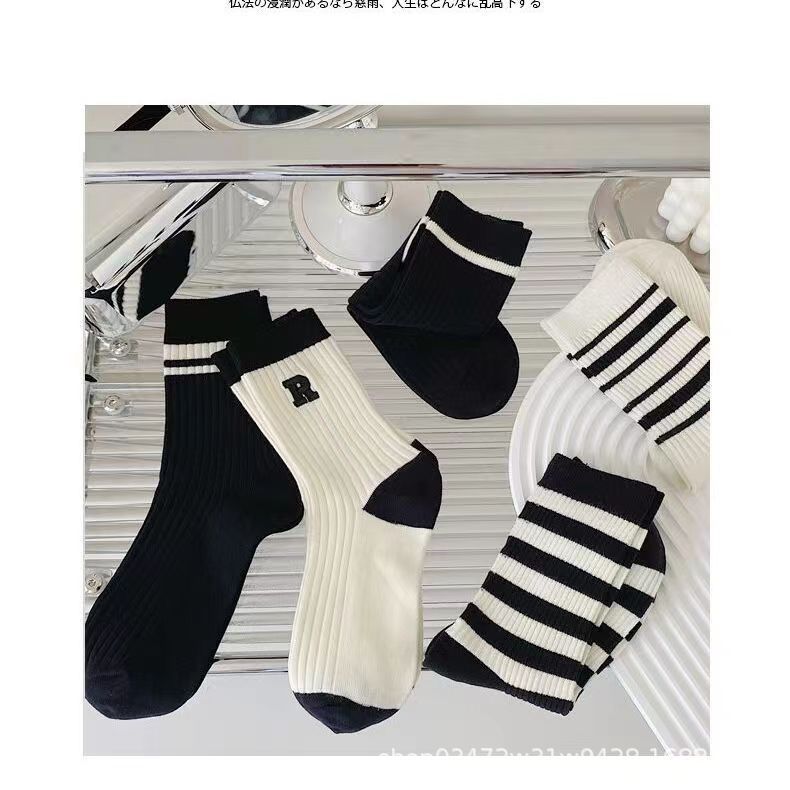 Calcetines primavera y verano niñas tubo medio color sólido mujer todo fósforo jk personalidad de tendencia tubo medio largo color sólido aguja gruesa apilamiento calcetines estilo delgado