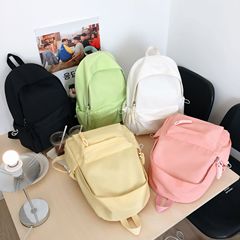 純色のネット版のランドセルの新型のファッションクールな大学の学生のランドセルの軽やかな百合の女子学生は授業のリュックサックのファッションに旅行します。