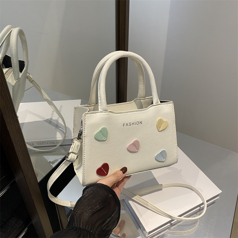 Bolso de mano de amor de la niña para mujeres 2024 nuevo bolso de hombro de verano de alta calidad sensación de super caliente bolso universal