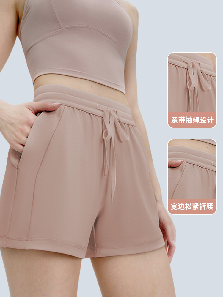 Verano nuevo estilo levantamiento de cadera pantalones cortos de yoga sueltos y simples mujeres pantalones de cuatro puntos delgados con cordón pantalones deportivos para correr