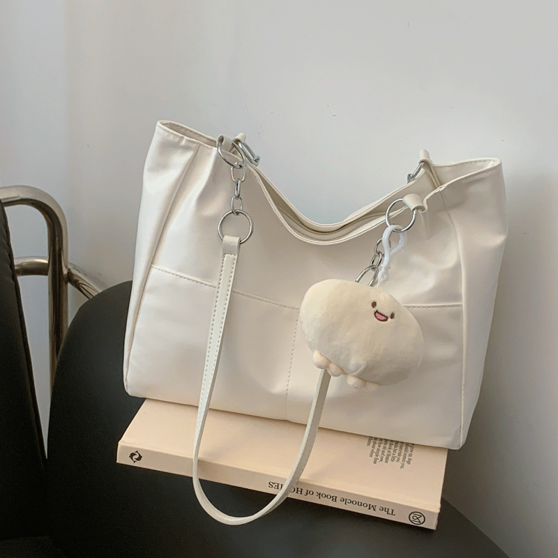 Alta sensación de bolso grande para mujeres 2024 nueva moda de verano de moda de gran capacidad de transporte bolsa bolsa de hombro de textura de mujer