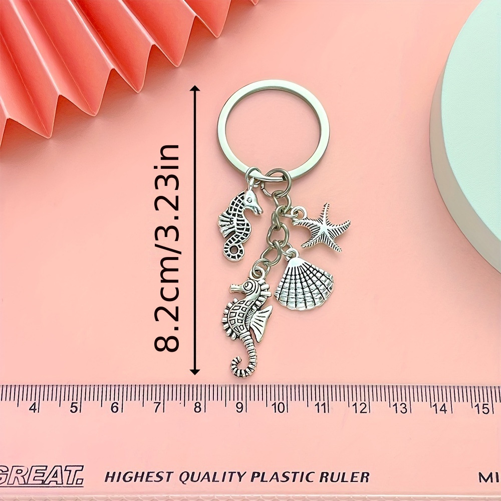 Serie de oro de aleación de venta transfronteriza caliente fútbol béisbol rugby sombrero hechicero puño llavero colgante mochila