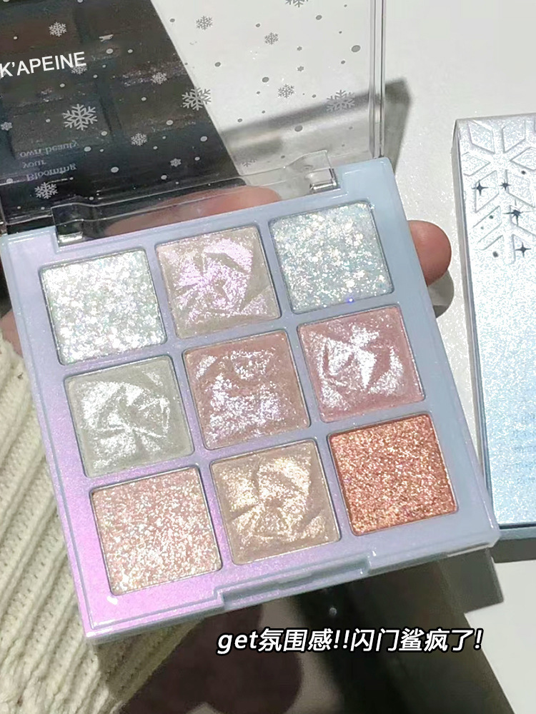 La paleta de sombras de ojos de nueve colores Capel Snowflake brilla y brilla, ilumina y ilumina el gusano de seda acostado, hielo y nieve, diamante, maquillaje transfronterizo
