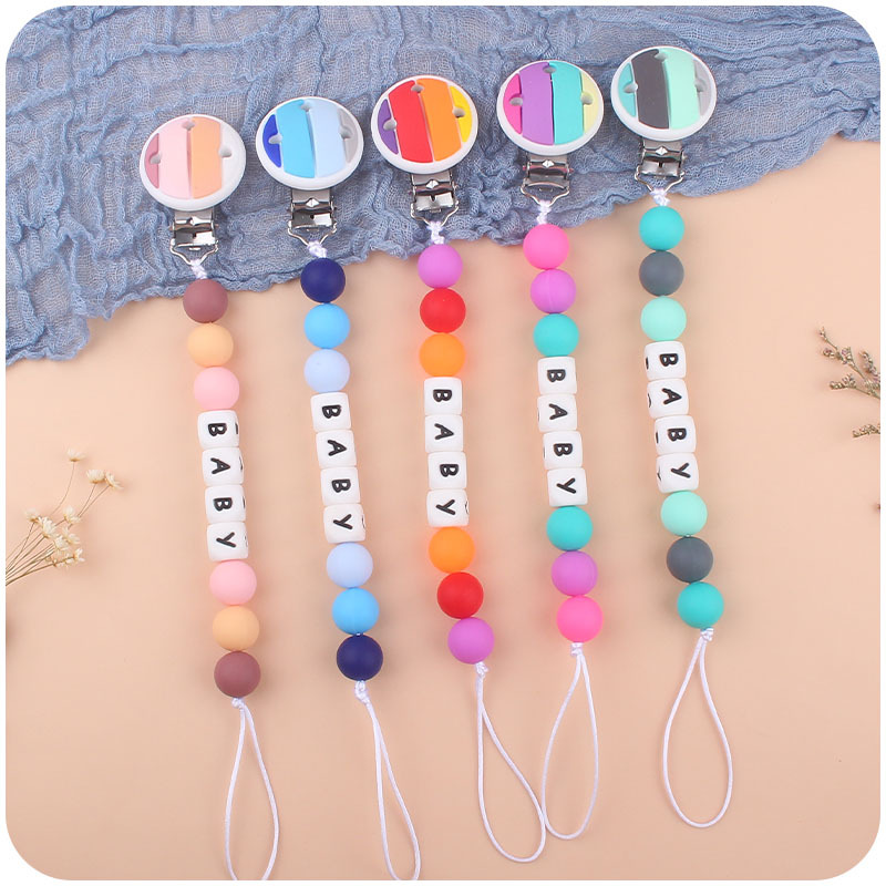 Bebé de dibujos animados clip de arco iris de silicona calmante bebé de dibujos animados arco iris de silicona teether palo de juguete