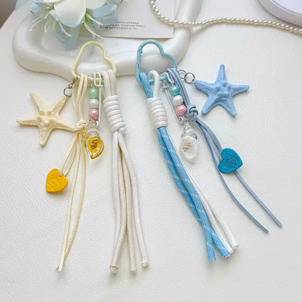 Ins-style starfish and conch woven keychain with heart-shaped tassels, a seaside vacation vibe bag accessory
