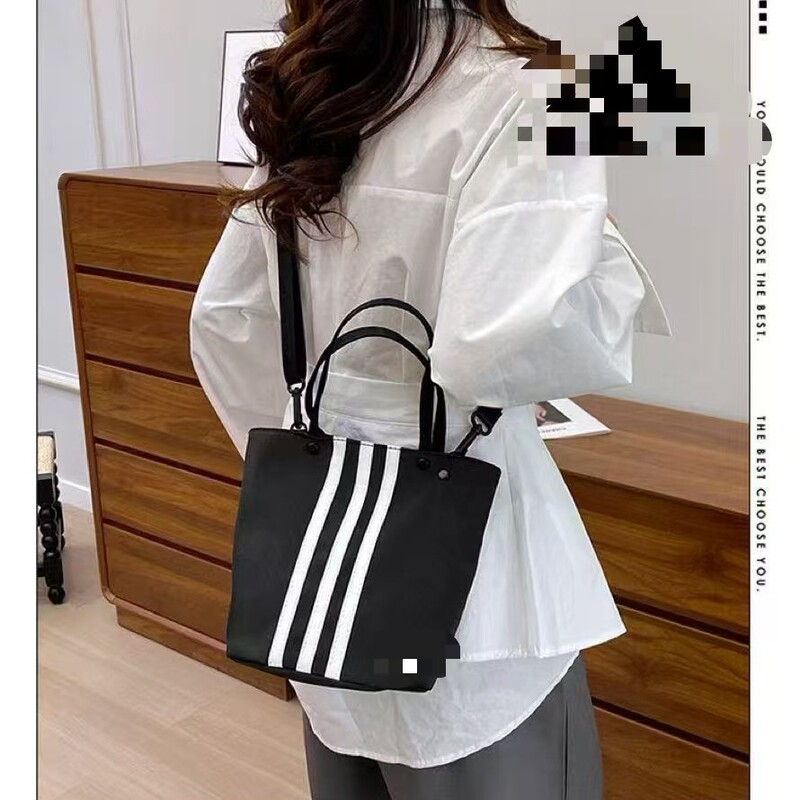 Adidas-Style Casual Sports Bucket Bag, Simple Commuter Portable Shoulder Bag, Large Capacity, Korean Version with Stripes Adidas-Style Casual Sports Bucket Bag, Simple Commuter Portable Shoulder Bag, Large Capacity, Korean Version with Stripes