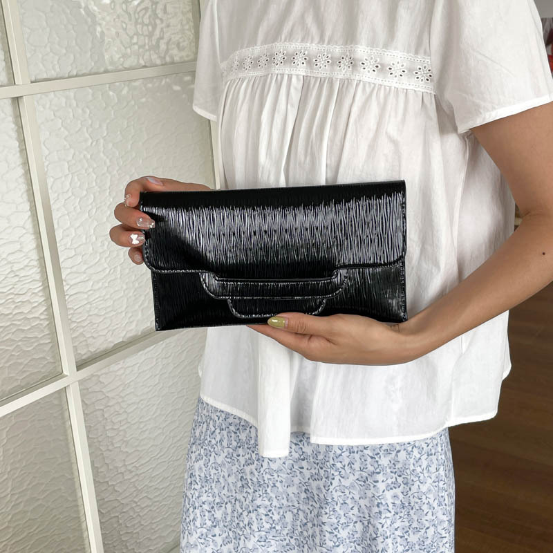 Bolsa de cena de color sólido para mujeres 2026 nueva moda ocio de gran capacidad temperamento personalidad bolso de cambio bolso de mano