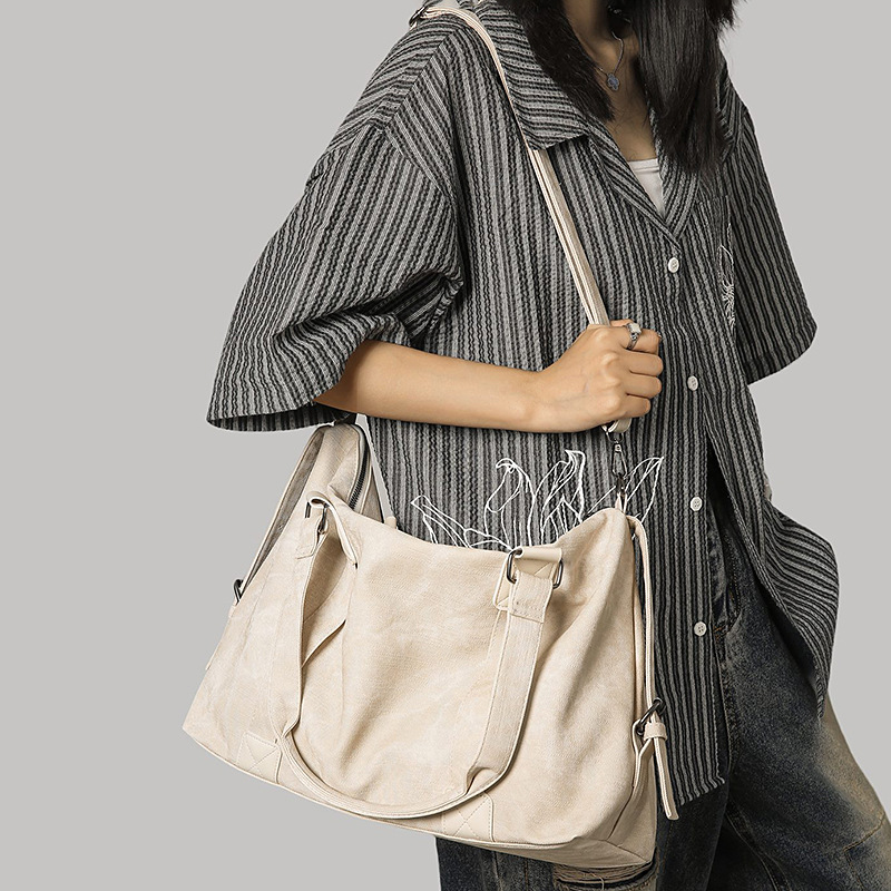 Meilad retro alta sensación bolso de gran capacidad de viaje corto bolso de mano casual versátil mochila de hombro