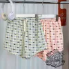 A pink butterfly shorts
