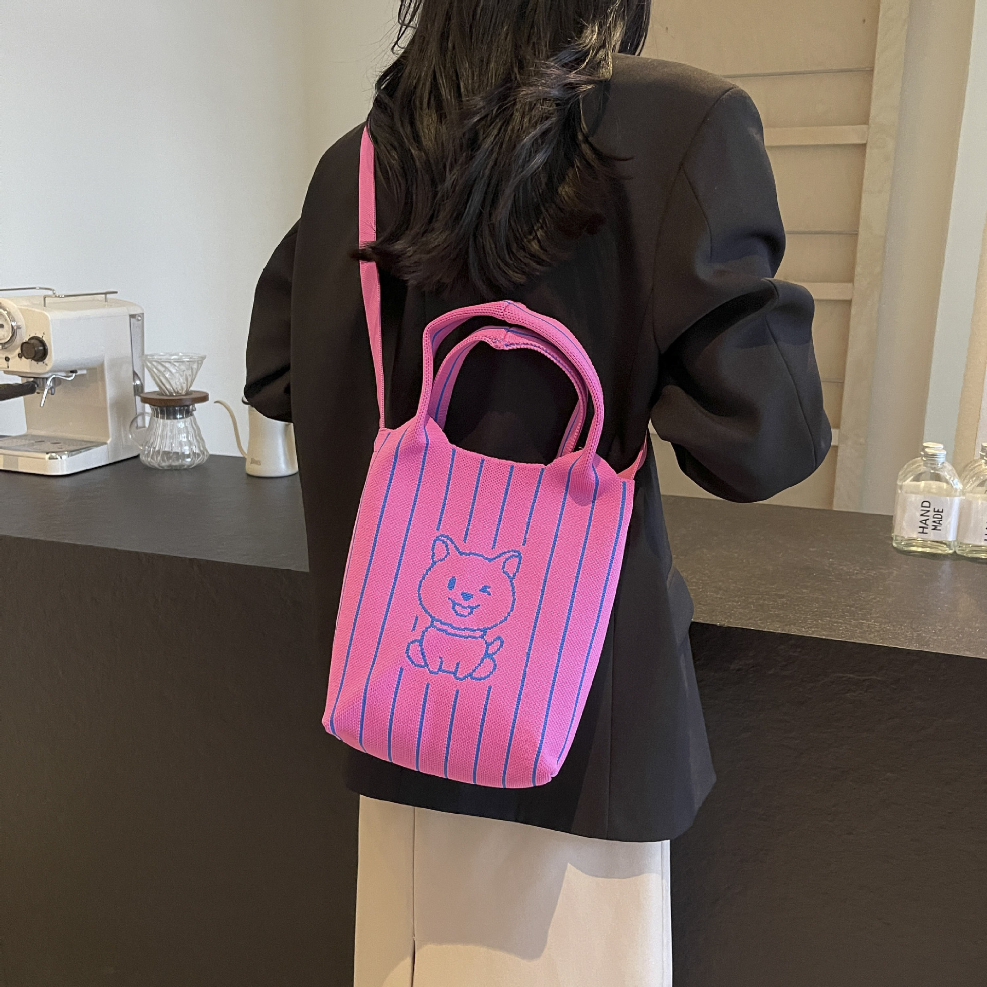 This handbag is a stylish knitted striped shopping bag. It's a popular lady's bear large-capacity tote single-shoulder bag for going out undefined
