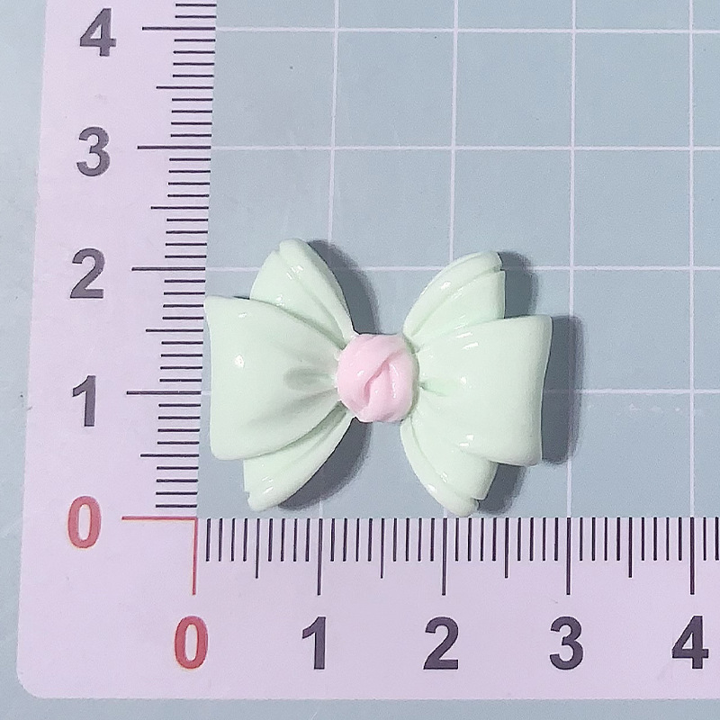 Nuevos accesorios de resina de color macaron de lazo de dibujos animados