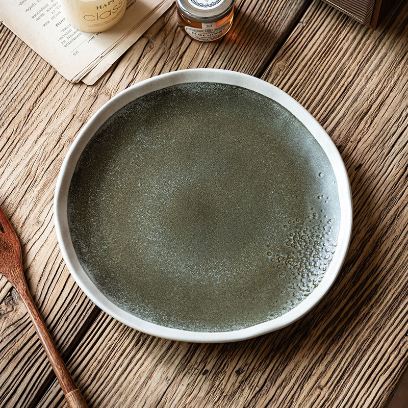 Placa de trazado blanco creativa Placa de filete de cerámica retro Placa doméstica irregular platos de comedor occidentales platos de comedor poco profundos