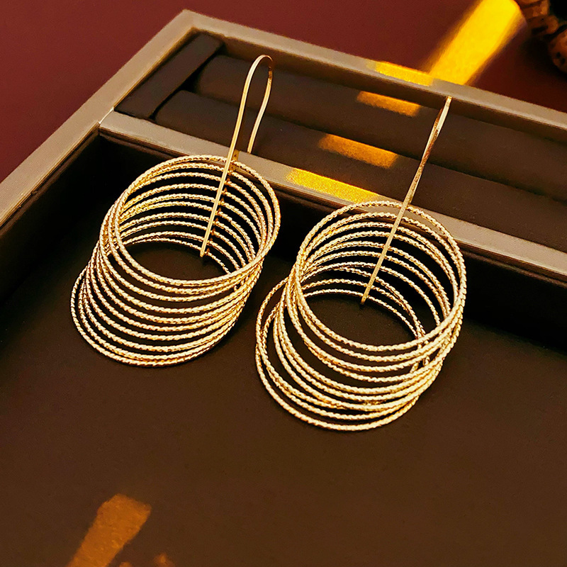 Aguja de plata MEDIADOS DE-antigua flor redonda borla pendientes de metal retro europeo y americano elegante luz pendientes de lujo al por mayor para las mujeres