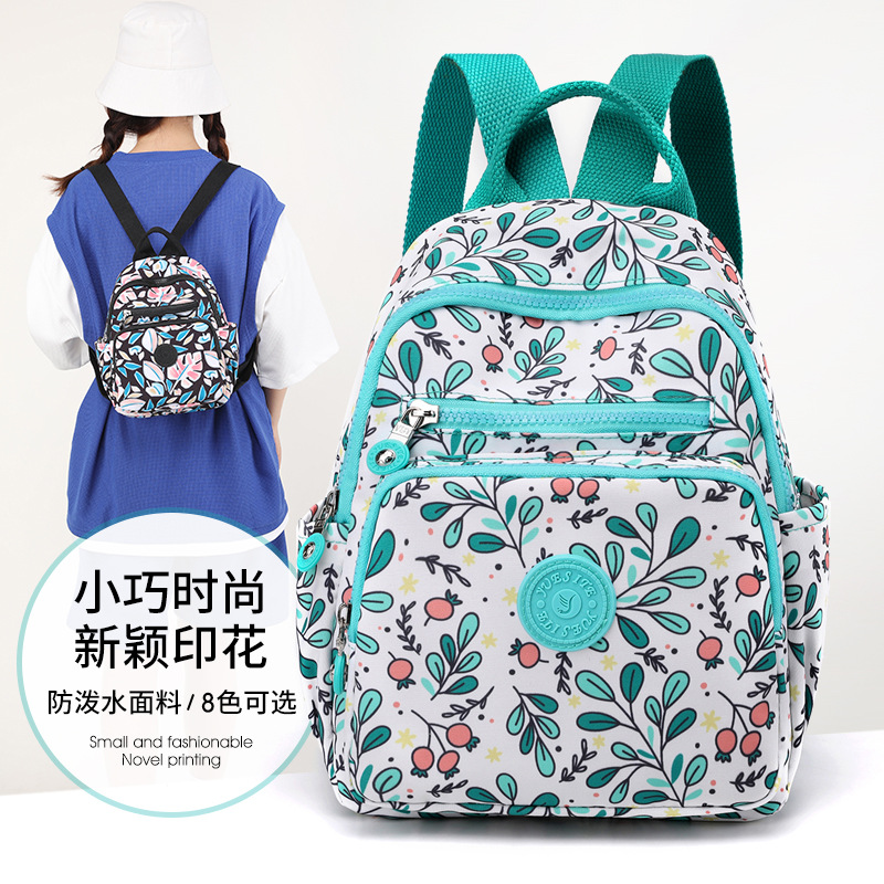 Nuevo estilo coreano mochila de mujer de moda de mediana edad y anciano madre viaje pequeña mochila de nylon mochila casual al por mayor