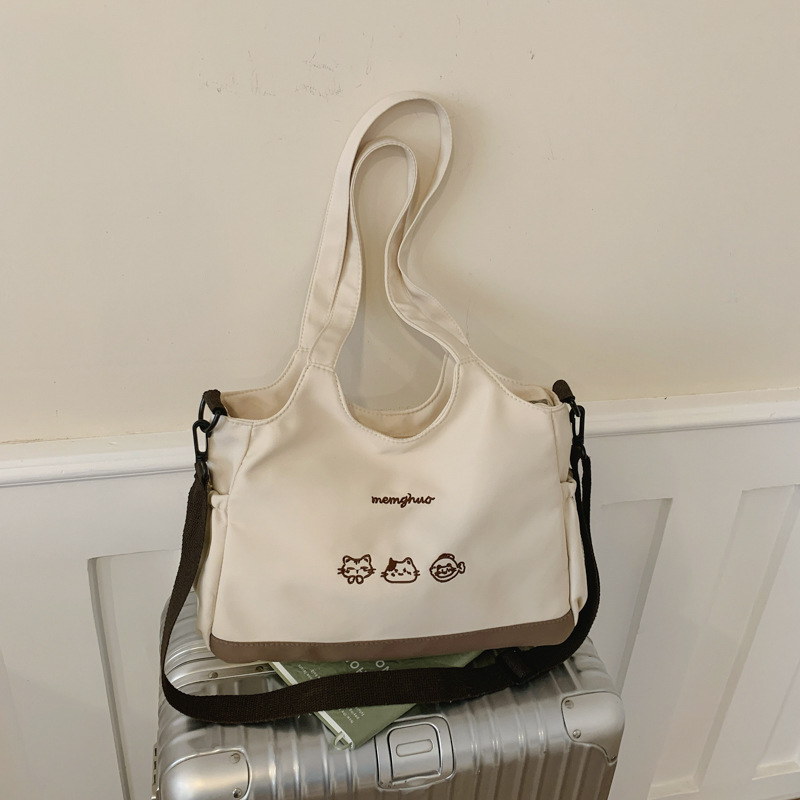 2026 nuevo lindo bolso de tote nicho de moda simple textura de viaje universal mujer gran capacidad mochila de hombro