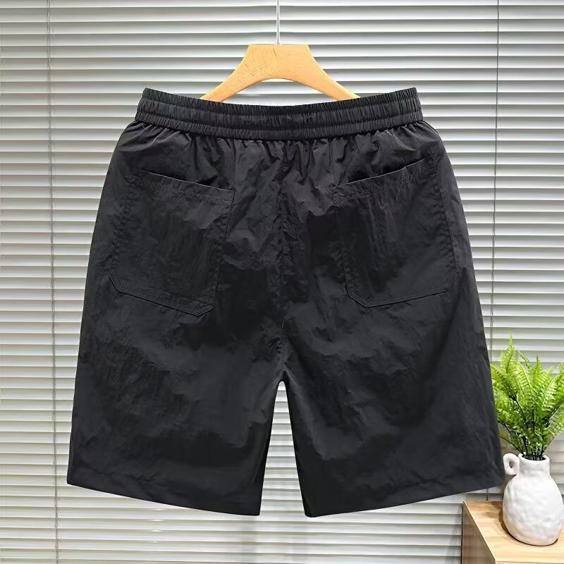 Nuevos pantalones de tendencia de cinco puntos para hombres comercio exterior transfronterizo de verano pantalones de playa para hombres pantalones cortos deportivos de cinco puntos para hombres pantalones de tendencia