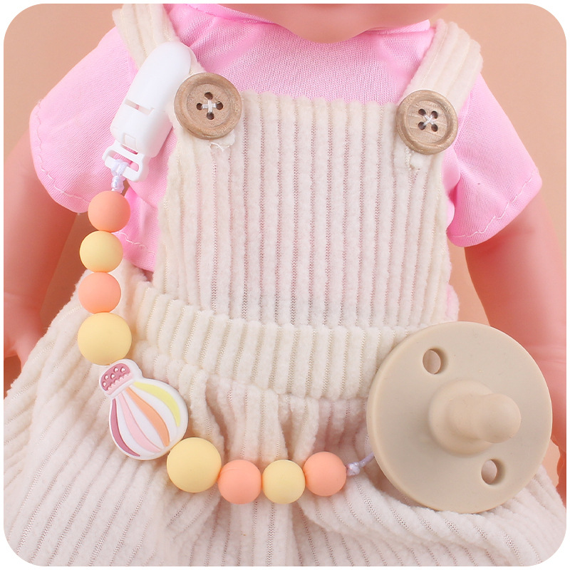 Nuevo bebé suministros chupete cadena creativa dibujos animados globo de aire caliente de silicona mordedura cadena anti-gota molar