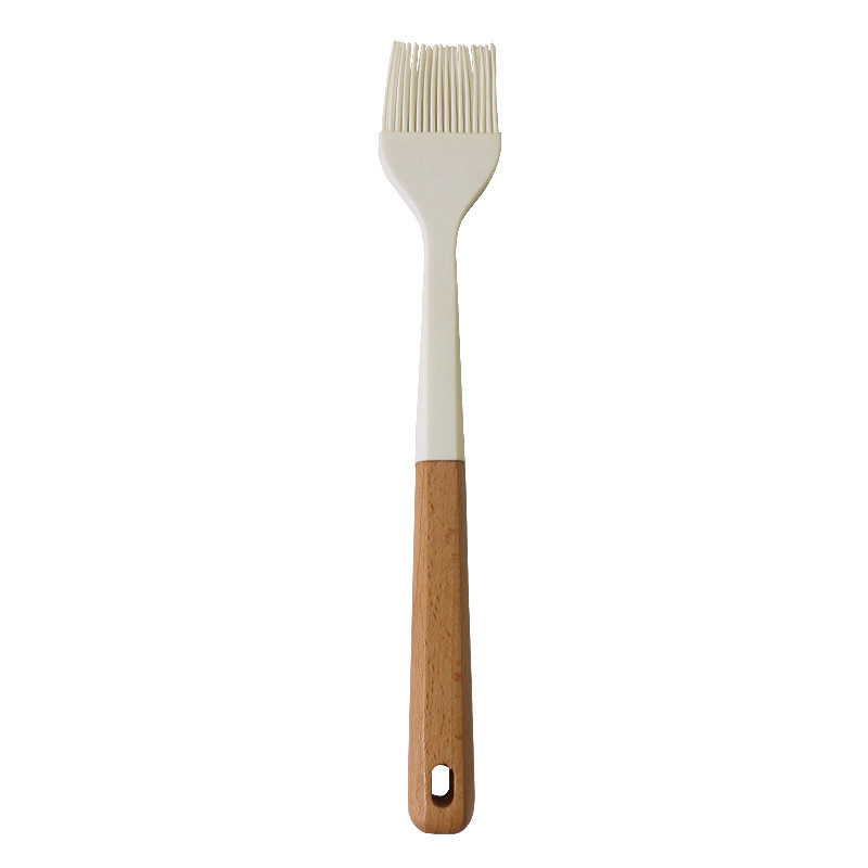 Cuchara de sopa de espátula de silicona transfronteriza Juego de 13 piezas de sartén antiadherente Pala de silicona de grado alimenticio Juego de utensilios de cocina de silicona blanca lechosa al por mayor