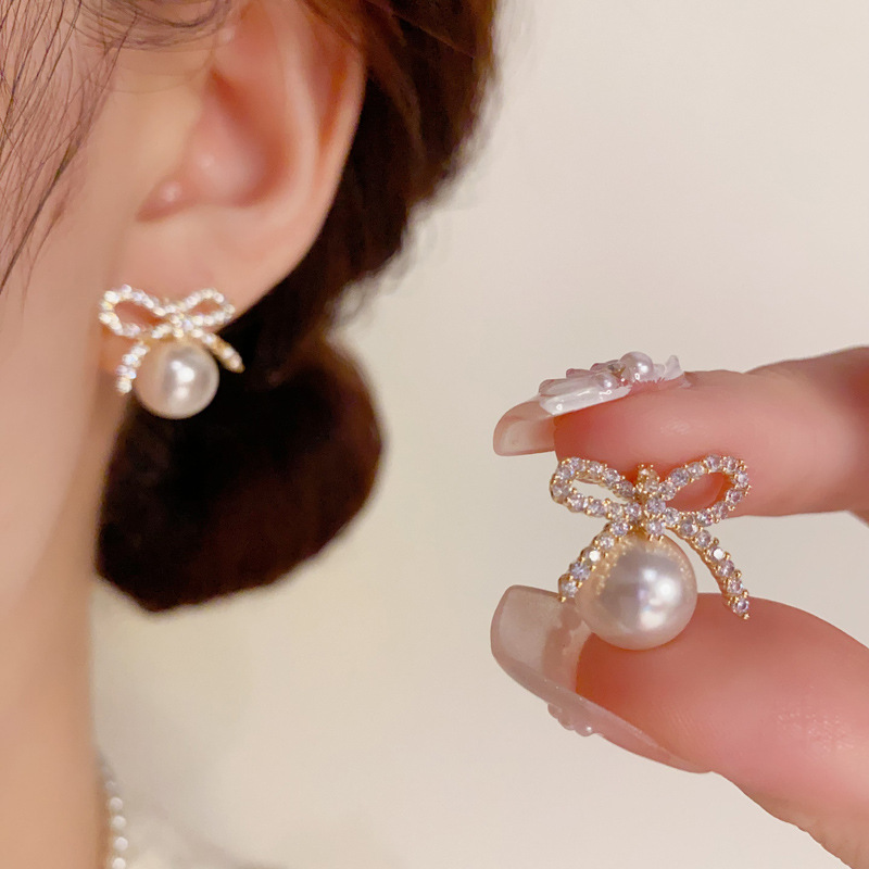 fashionable small design earrings with zircon with bow from pearl