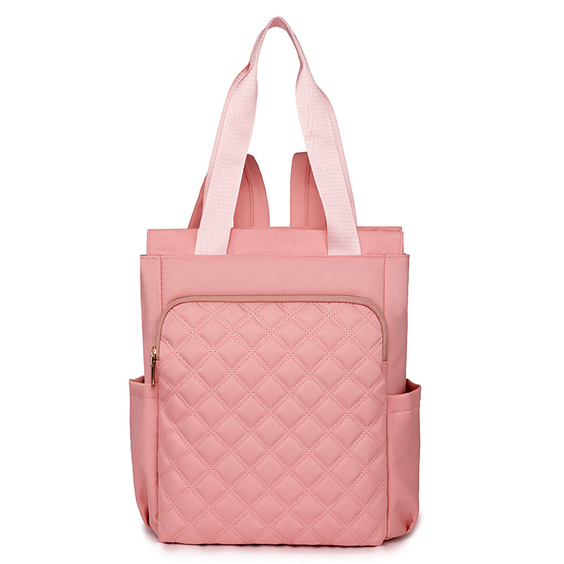 Mochila de mujer salvaje de color puro 2024 nueva mochila portátil de moda, bolso de viaje ligero y de gran capacidad