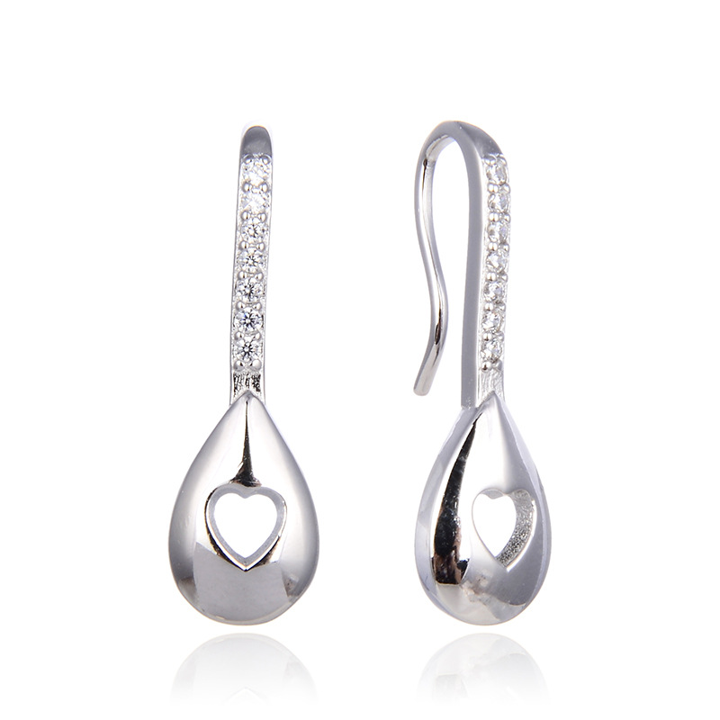 Accesorios elegantes huecos en forma de corazón para mujer estilo japonés y coreano s925 pendientes de plata incrustados en diamantes pendientes de diseño creativo transfronterizo
