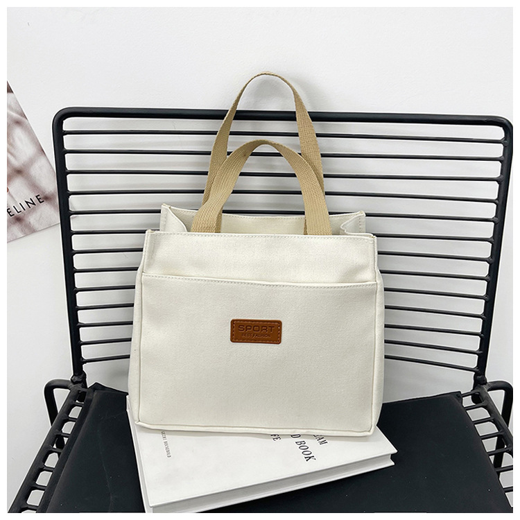 New wholesale fashionable and high-quality canvas handbag, simple and portable, easy to carry for going out, versatile lunch box and bento bag undefined